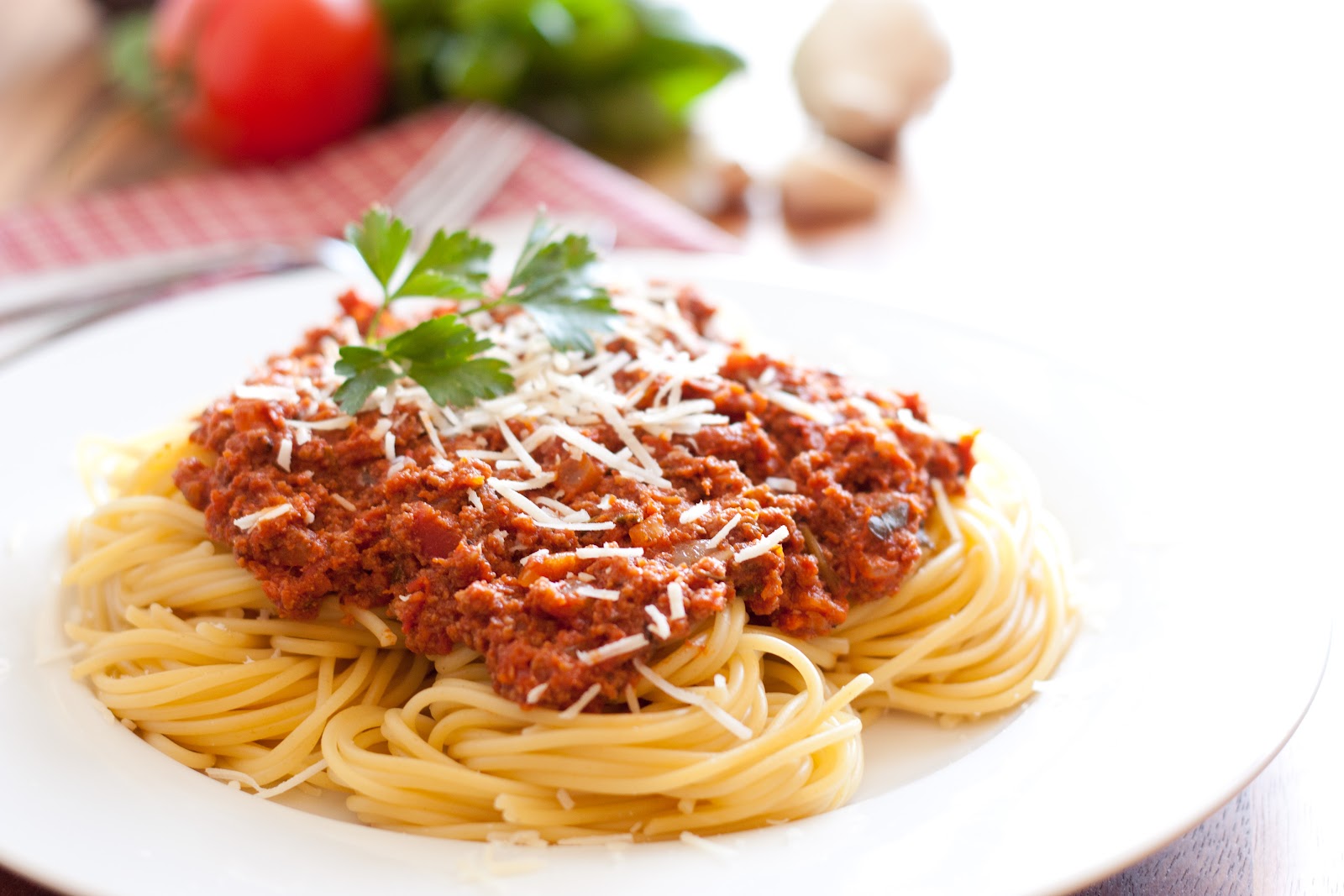 A plate of spaghetti with mozzarella.